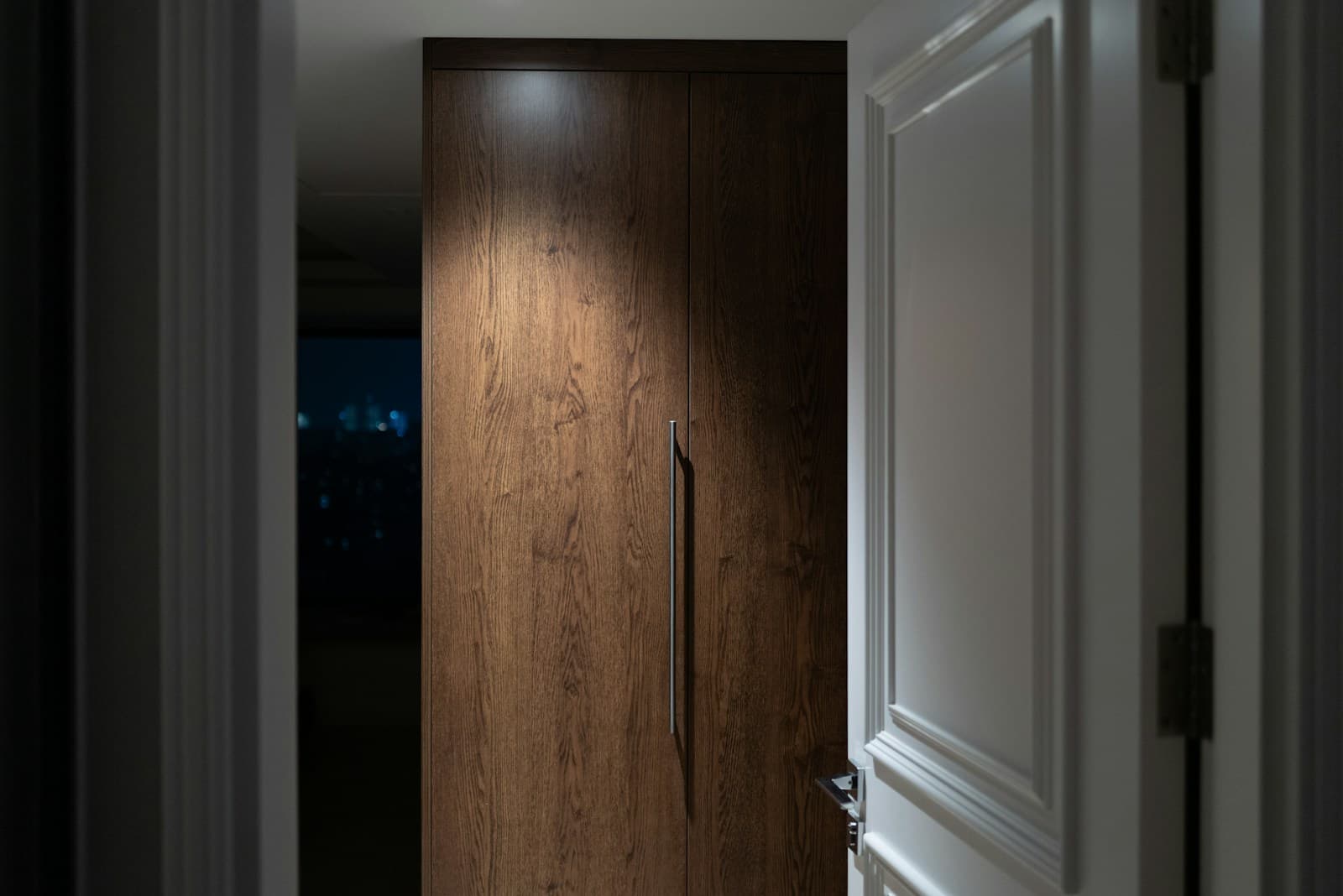 Premium wood-finish UPVC door with modern handle for residential interiors
