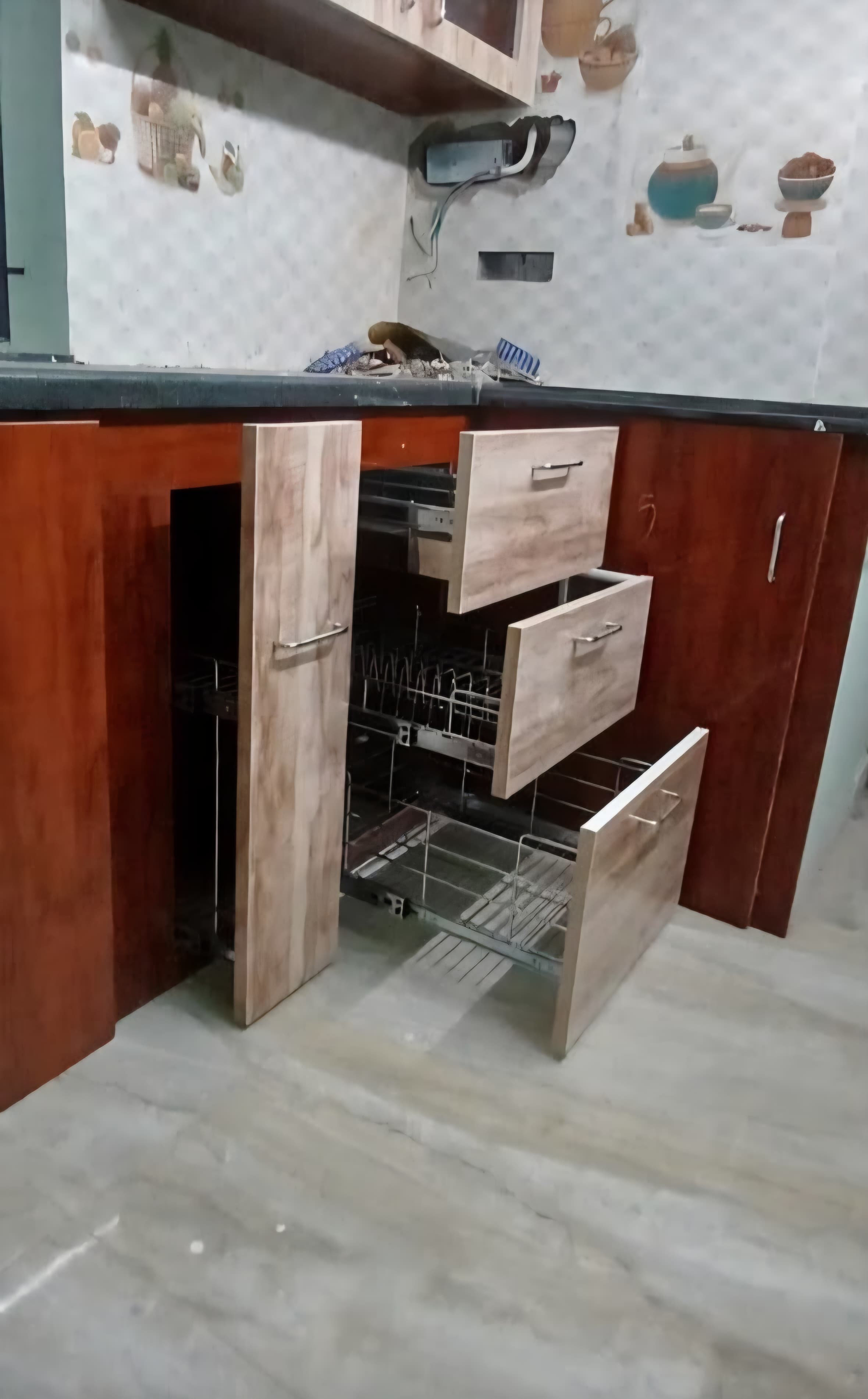 Modular kitchen with pull-out pantry drawers and plate rack storage